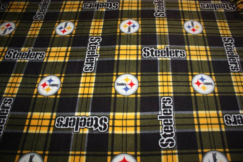 May include: Black and yellow plaid fabric with the Pittsburgh Steelers logo and the word "Steelers" repeated throughout.