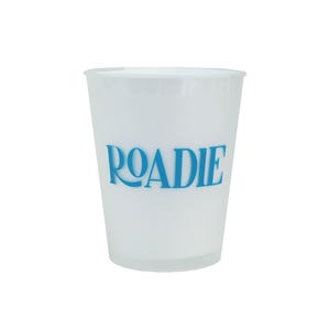 May include: A translucent white plastic cup featuring the word ROADIE printed in a bold, bright blue font across the center. The cup has a tapered cylindrical shape with a smooth rim and a flat base, designed for holding beverages.