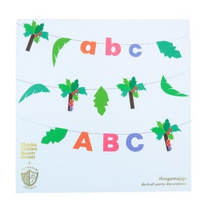 May include: A square card featuring party decorations. The design includes strings of colorful letters spelling "abc" and palm tree and leaf cutouts. The text "Chicka Chicka Boom Boom" and "thingamajigs do-it-all party decorations" are also visible.