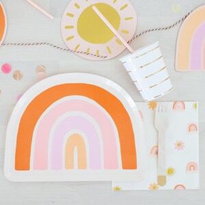 May include: A rainbow-themed paper plate with a white background and orange, pink and peach stripes. The plate is shaped like a rainbow arch.