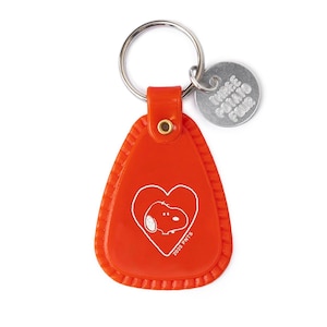 May include: A red Snoopy keychain with a silver keyring and a small metal tag. The keychain features a white Snoopy illustration inside a heart, with the text "2025 PNTS". The metal tag reads "THREE POTATO FOUR".