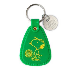 May include: Green Snoopy keychain with a tennis racket graphic and a metal ring. The keychain has a metal tag that says "THREE POTATO FOUR". The copyright date is 2025.