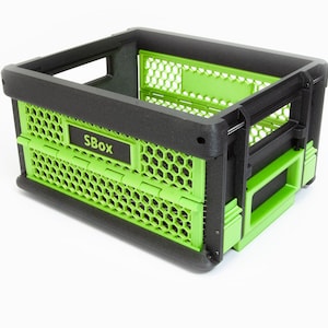 May include: A green and black foldable storage bin with a honeycomb pattern and the text "SBox" printed on the side.