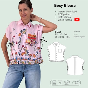 Könnte beinhalten: Eine rosa Bluse mit kurzen Ärmeln, floralem Muster und einer Tasche. Die Bluse hat schwarze Bindebänder an den Seiten und ist zugeknöpft. Der Text "Boxy Blouse" steht oben, darunter Größenangaben und der Schwierigkeitsgrad.