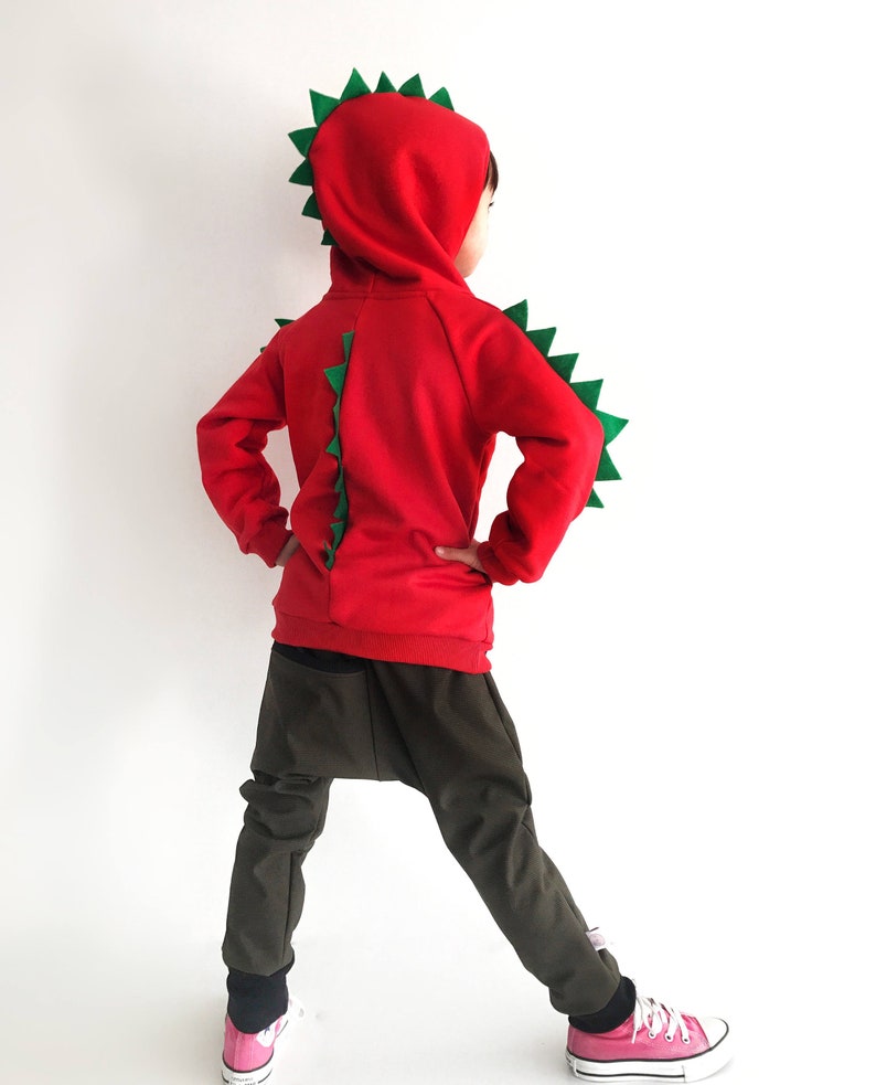 dinosaur with hood on head