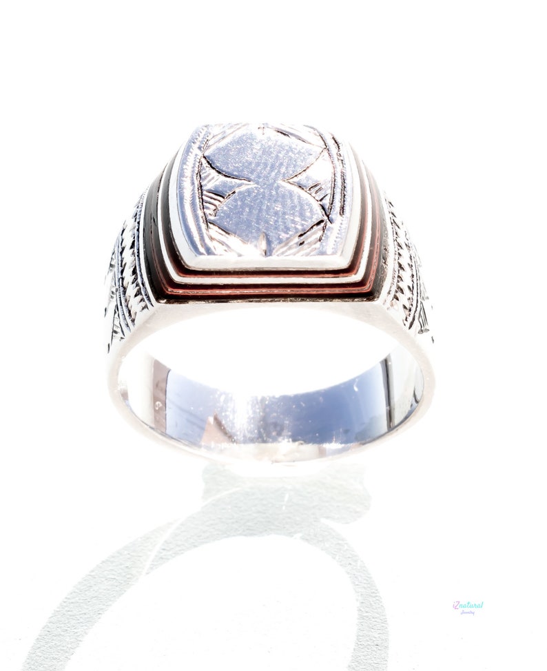 Tuareg ethnic silver ring with carved tribal wood inlaid.