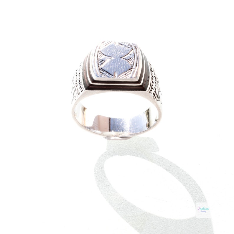 Tuareg ethnic silver ring with carved tribal wood inlaid.