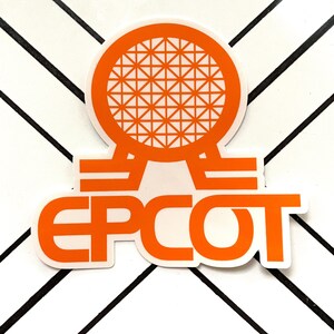 May include: Orange and white sticker with the Epcot logo. The logo features a sphere with a grid pattern and the word "Epcot" in a bold, sans-serif font.