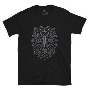 May include: Black t-shirt featuring a white geometric design. The design is a circular pattern with various shapes, including lines, spirals, and a central tuning fork-like symbol. The shirt has a crew neck and short sleeves.