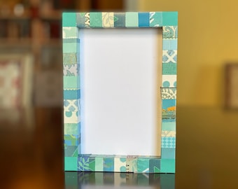 Decorative teal picture frame, striped, collaged with vintage and recycled papers