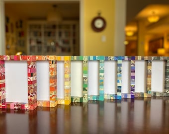 Decorative picture frame, striped, collaged with vintage and recycled papers