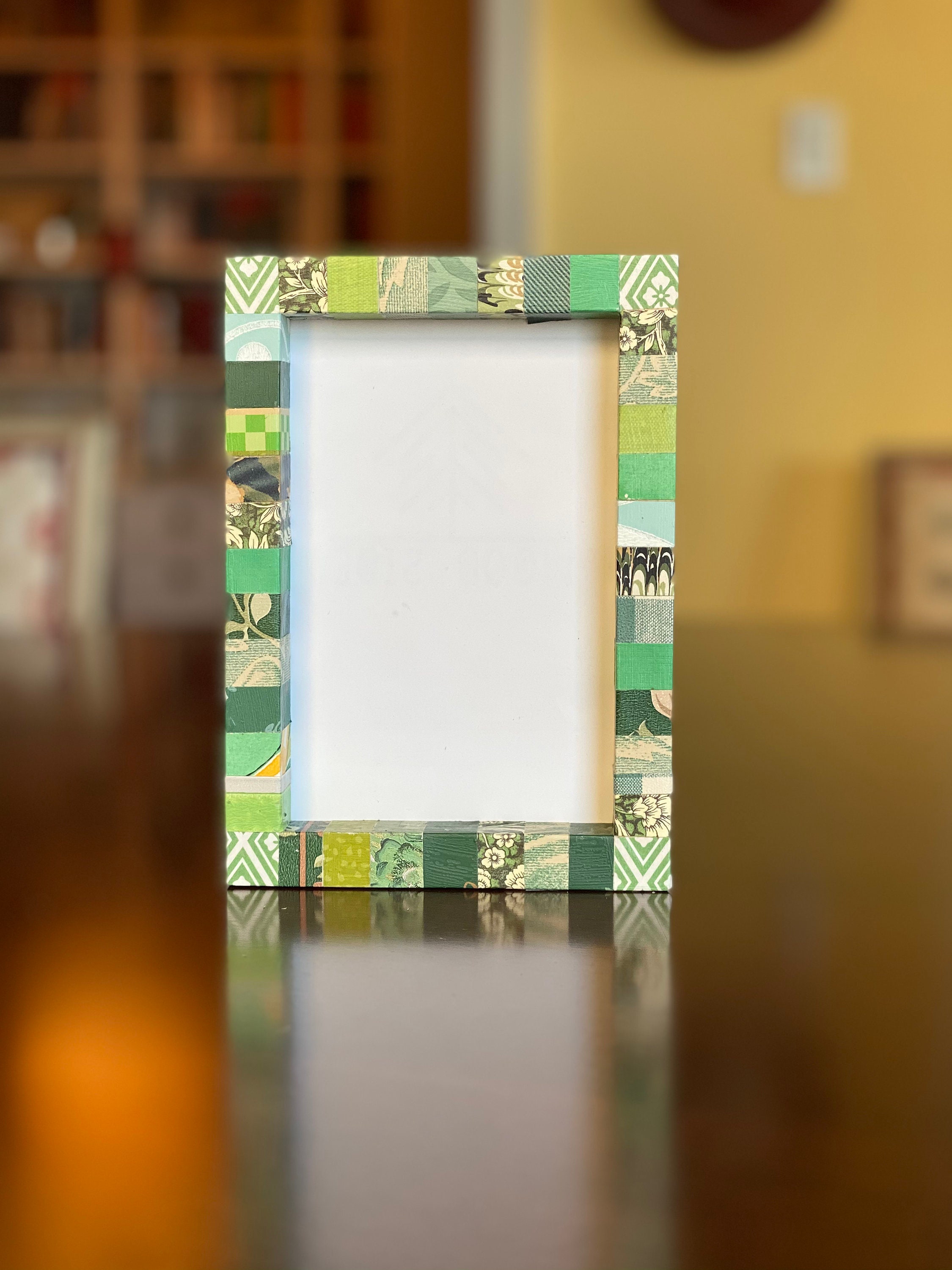 Decorative green picture frame, striped, collaged with vintage and recycled papers