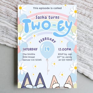 May include: A light blue birthday invitation with the text "Sasha turns Two-ey" and "February 14". The invitation features a rainbow, daisies, balloons, and cartoon dog ears.