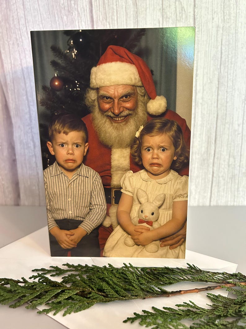 May include: A greeting card featuring a vintage photograph of Santa Claus with two children. The children have distressed expressions. Santa is wearing a red suit and hat. The girl is holding a stuffed bunny. A Christmas tree is in the background.