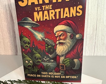 May include: A rectangular greeting card featuring a graphic illustration of Santa Claus holding a ray gun against three green aliens and a flying saucer. The text reads SANTA VS. THE MARTIANS and THIS HOLIDAY... PEACE ON EARTH IS NOT AN OPTION!