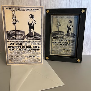 May include: A vintage circus poster and framed print with a black frame and gold star accents. The poster features illustrations of acrobats and text that reads "Pablo Fanque's Circus Royal" and "Last Night But Three!"