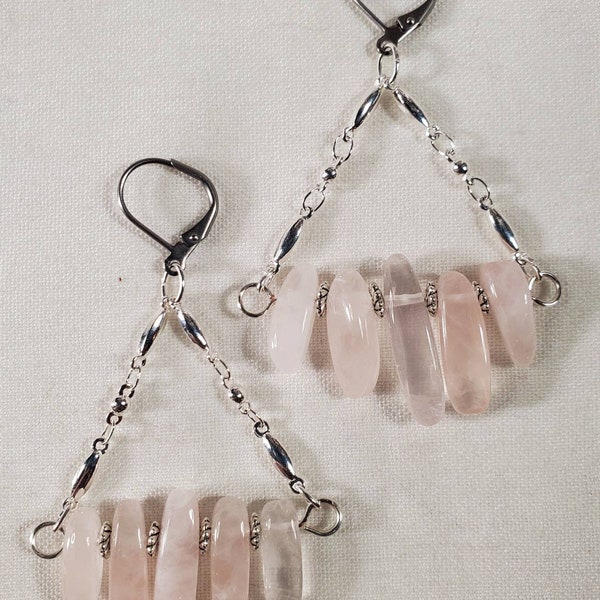 Rose Drops are rose quartz daggers on silver chain earrings.