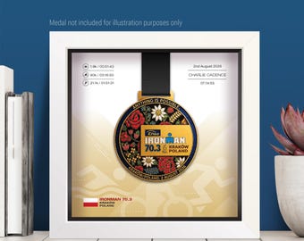 May include: A white square display frame containing a circular gold Ironman 70.3 Krakow Poland medal with floral details. The background features race statistics, the date 2nd August 2026, the name Charlie Cadence, and a swimming and cycling graphic.