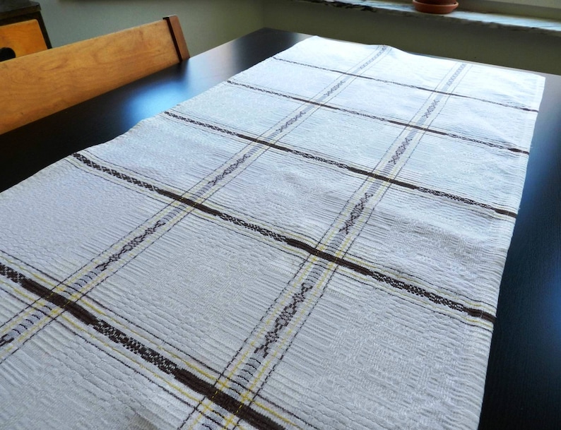 Vintage table runner with a brown and yellow design from Sweden