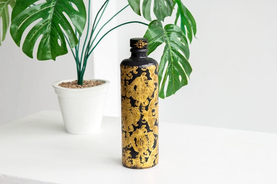 装飾的な黒と金の陶器ボトル 装飾的な黒と金の陶器ボトル