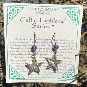 May include: Sterling silver Celtic Highland Series earrings with amethyst stones. The earrings feature a star design inspired by the Book of Kells.