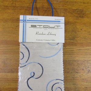 Rainbow Library fabric sample book in Mediterranean blues