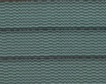 Large remnant 1961 Chevrolet padded channel abstract upholstery fabric in greenish blue