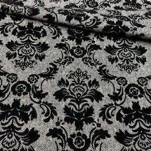 May include: A fabric featuring a repeating black damask pattern set against a textured grey background. The black design consists of intricate floral and scroll motifs that create a high-contrast visual effect across the entire surface of the material.