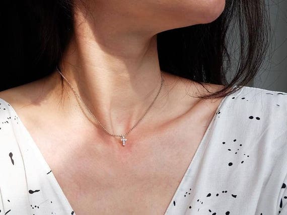 Layered sideways on sale cross necklace