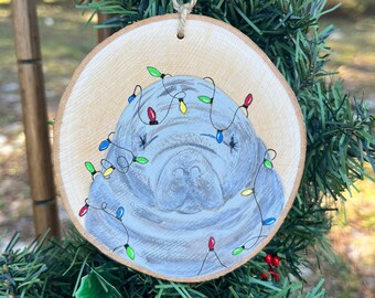 Manatee in holiday lights hand painted wood slice ornament, Christmas, springs sea cow, endangered species, aquatic