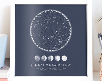 May include: A navy blue framed print with a white star constellation map and the text "THE DAY WE SAID "I DO"" SHROPSHIRE AUGUST 1ST 2019 (52.6003°N, 2.4026°W)"
