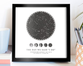 May include: A black and white star map print with a black frame. The print shows the night sky on 1st August 2019 in Shropshire, England. The text "THE DAY WE SAID "I DO"" is below the map, along with the coordinates (52.6003°N, 2.4026°W).