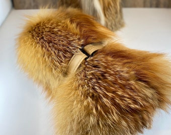 Long mittens, red fox fur, red leather palms and removable fleece lining, adjustable leather straps at the wrist.