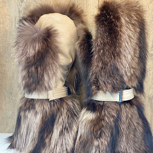 Long mittens, LONG-HAIRED RATON fur, leather palms and removable fleece lining, adjustable leather straps on the wrist.