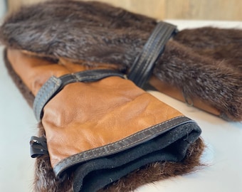 Long mittens, real beaver fur, leather palms and removable fleece lining, Adjustable leather straps at the wrist.