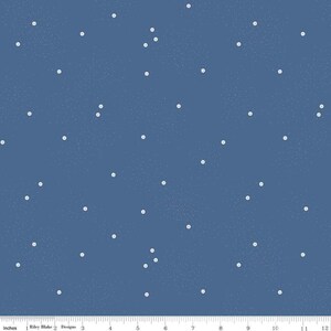 May include: A blue fabric with a white polka dot pattern. The fabric is a solid blue color with white dots scattered throughout. The dots are small and evenly spaced.