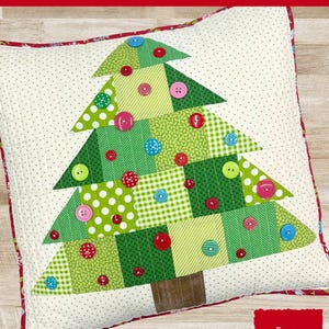 May include: A green button tree pillow pattern with a white background. The pillow is 18 inches by 18 inches. The pattern includes the text "The Tipsy Needle" and "Button Tree Pillow Pattern".