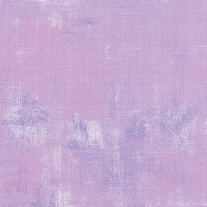 May include: A textured background in shades of light purple and pink. The background has a subtle, faded, and distressed look.