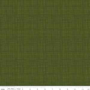 May include: Olive green fabric with a textured, crosshatch pattern. The fabric has a grid-like design, with darker green lines overlaying a lighter green background. The image includes a ruler along the bottom, with measurements in inches.