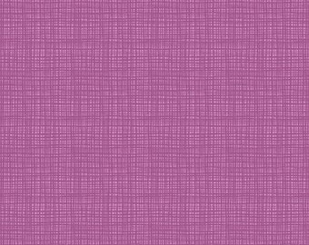 May include: A close-up of a pink fabric with a woven texture. The fabric has a subtle, light pink color and a fine, even weave.