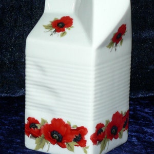 Milk carton shaped jug off white ceramic decorated with colourful poppies