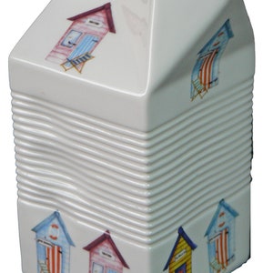 Milk carton shaped jug off white ceramic decorated with colourful beach huts