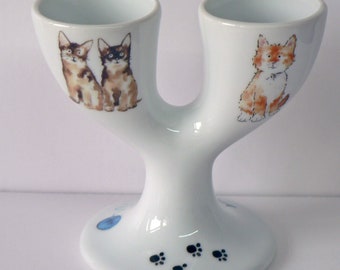 Cats design double egg cups. Porcelain eggcup designed for 2 boiled eggs