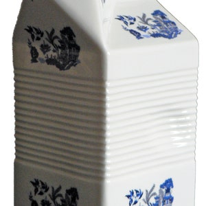 Milk carton shaped jug off white ceramic decorated with blue willow patten