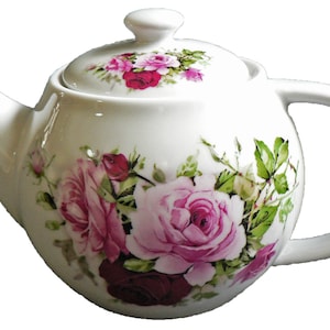 May include: White ceramic teapot decorated with pink, red, and green rose floral patterns. Features a curved handle, spout, and a lid with a knob. A traditional teapot for serving tea, ideal for a tea party.