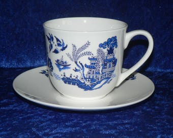 Blue willow pattern cup and saucer set. Traditional blue willow pattern on a fine bone china cup and saucer