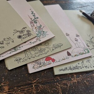 Samples writing paper nature selection pack, recycled paper stationery illustrated with insects, wildflowers and mushrooms. Goblincore