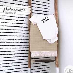 Scandinavian boho dots removable wallpaper in a baby room