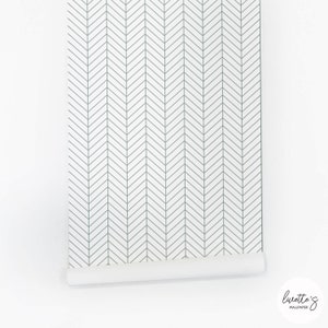 The panel of the sage green herringbone wallpaper