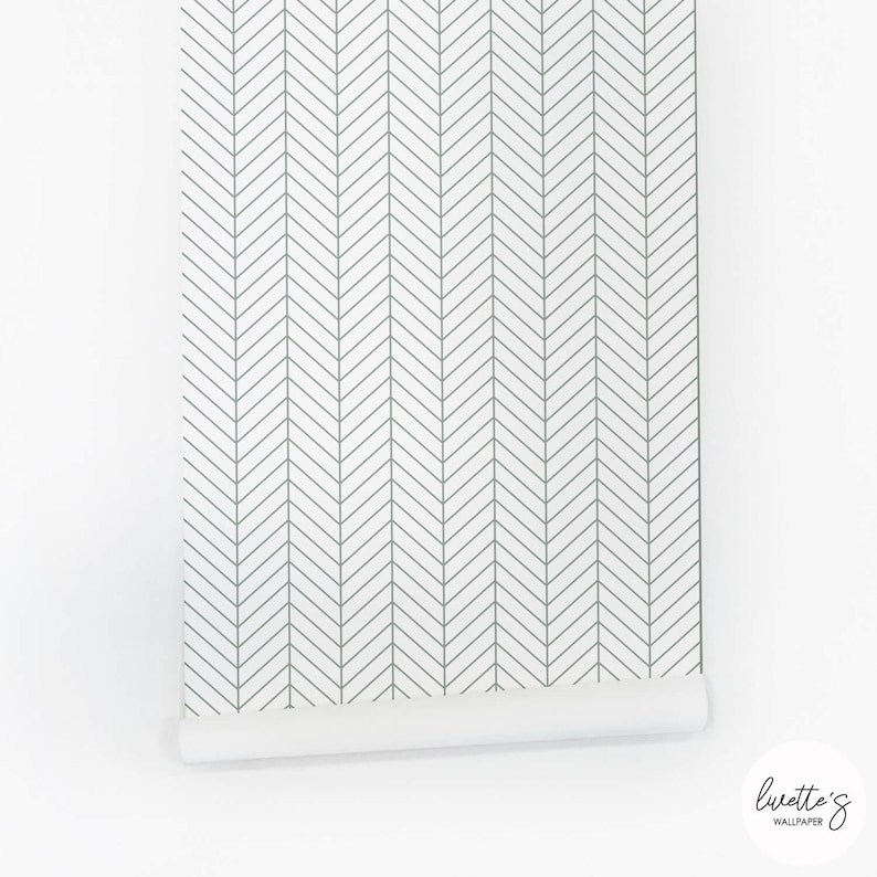 The panel of the sage green herringbone wallpaper